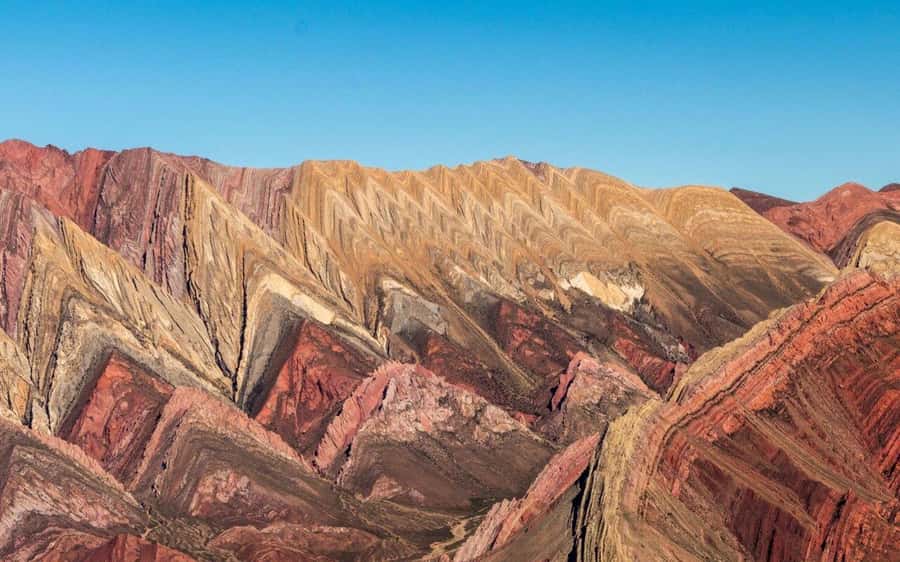From Salta: Serranías del Hornocal & Hill of 14 Colors Tour - Volcán and the first look at local life