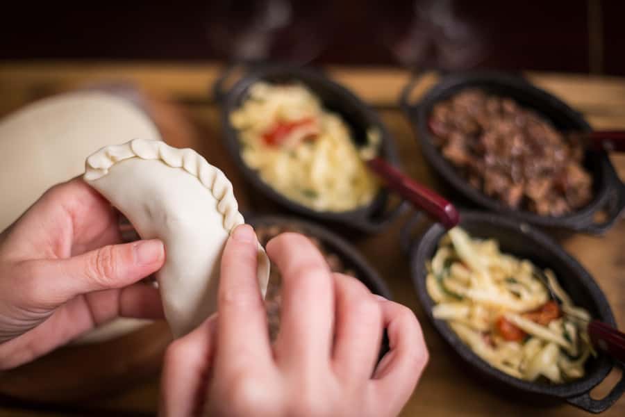 Iguazu Falls: The Argentine Experience Interactive Dinner - Folding empanadas with your own repulga